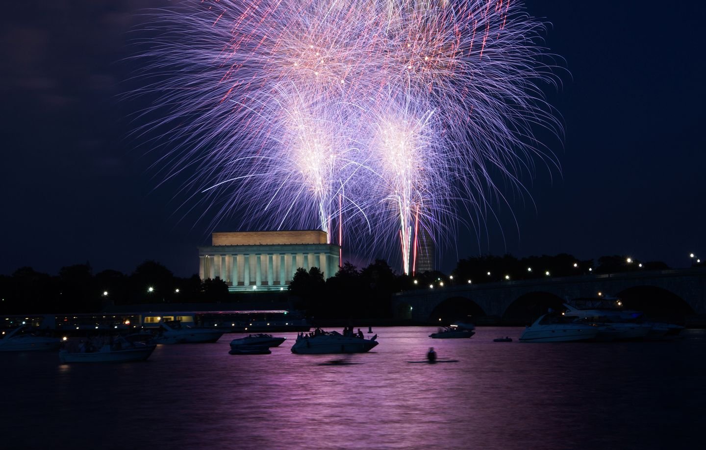Fireworks bursting over a night sky at a Garden State Fireworks show